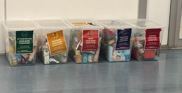 Charity boxes labelled with each house logo